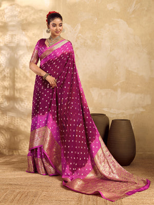 a red and pink Viscos silk bandhani saree with zari border and a pink blouse