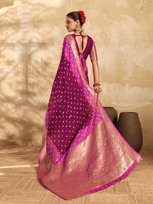 a red and pink Viscos silk bandhani saree with zari border and a pink blouse