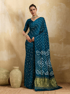 A blue saree with bandhani print and a lagdi patla pallu,