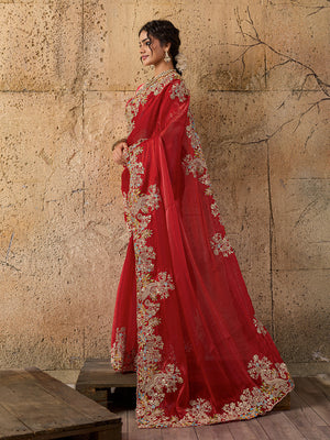 A red saree with floral embroidery