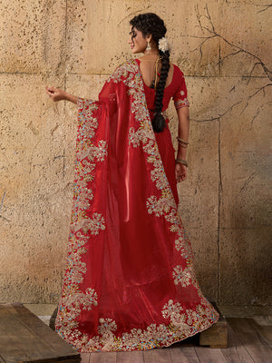 A red saree with floral embroidery