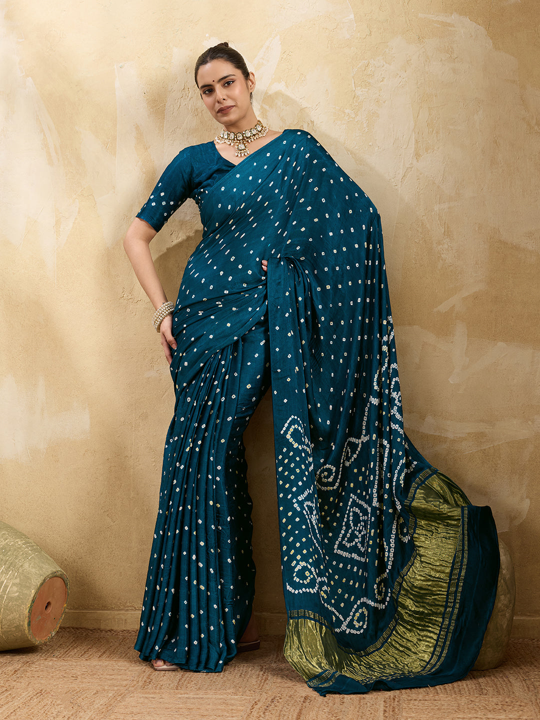 A blue saree with bandhani print and a lagdi patla pallu,
