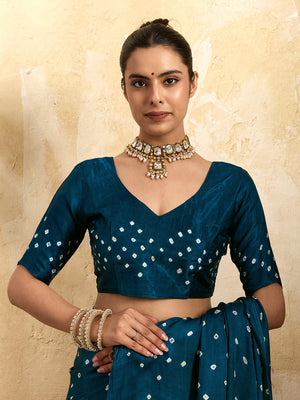 A blue saree with bandhani print and a lagdi patla pallu,