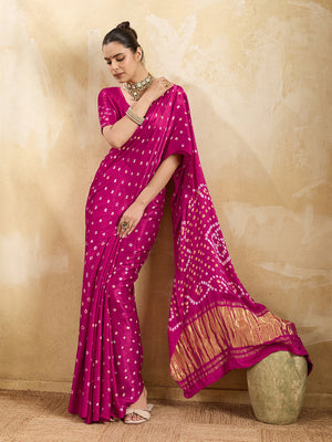 A pink saree with a bandhani pattern and a lagdi pallu design,