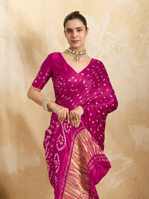 A pink saree with a bandhani pattern and a lagdi pallu design,