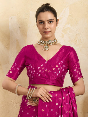 A pink saree with a bandhani pattern and a lagdi pallu design,