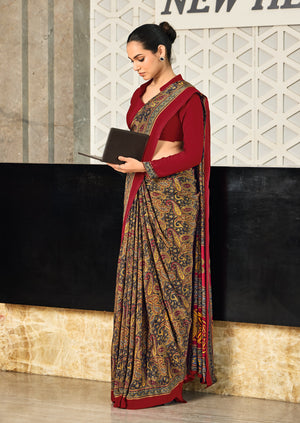 red and multicolor crepe silk saree with a geometric pattern and a red
blouse under 1500