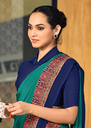 green and blue crepe silk saree with a red border under 1500