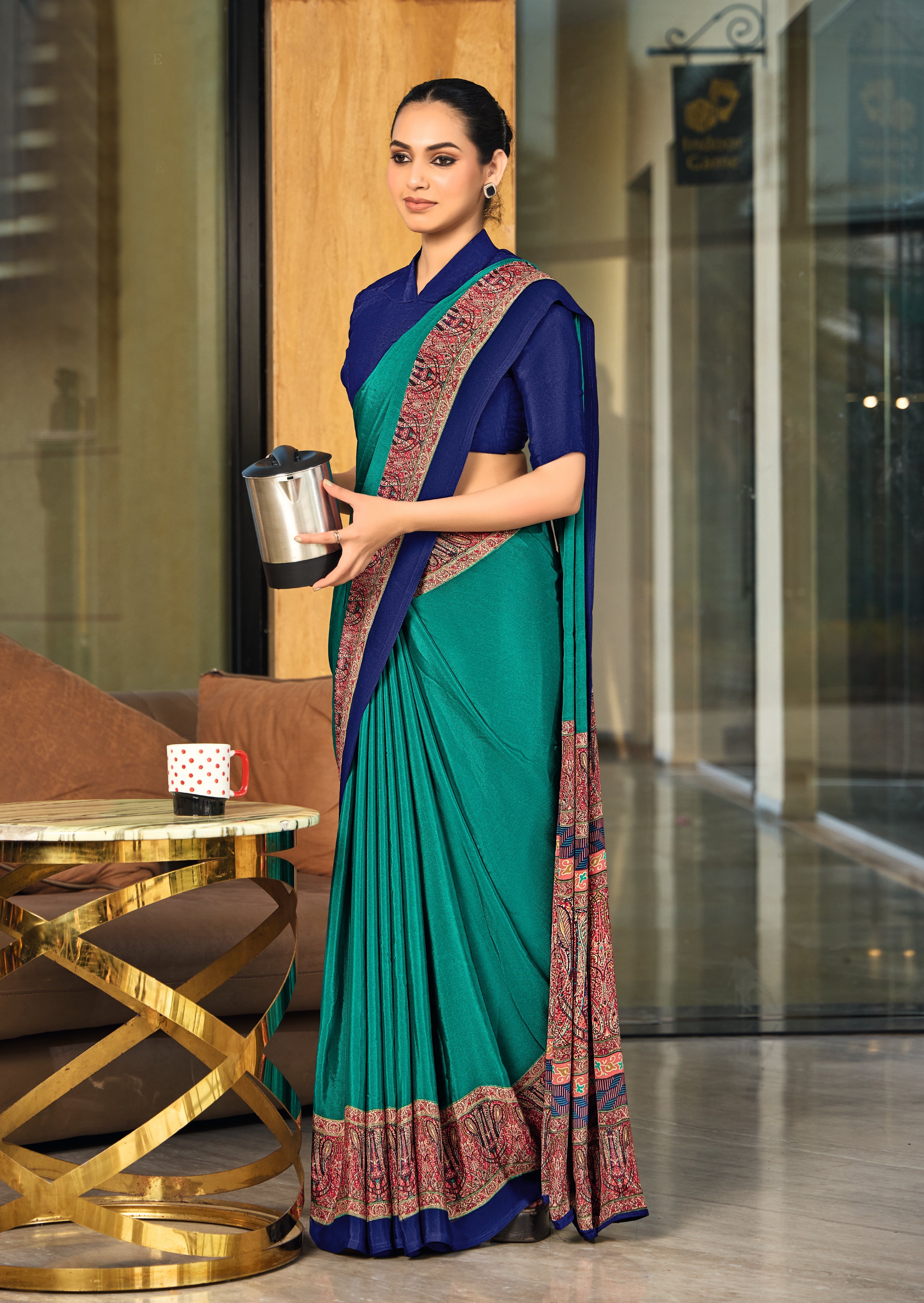 green and blue crepe silk saree with a red border under 1500