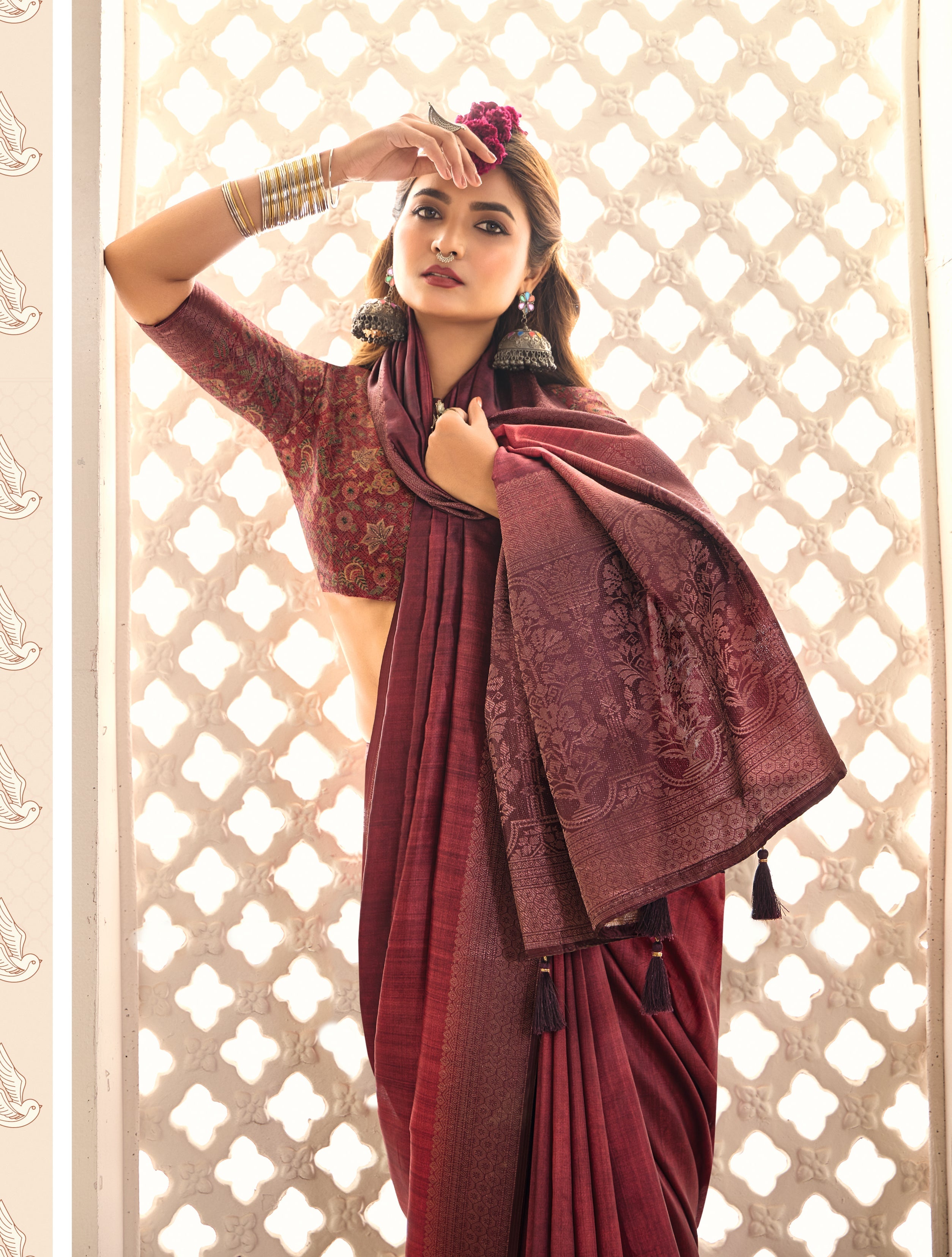 A wine red Banarasi style tissue silk saree