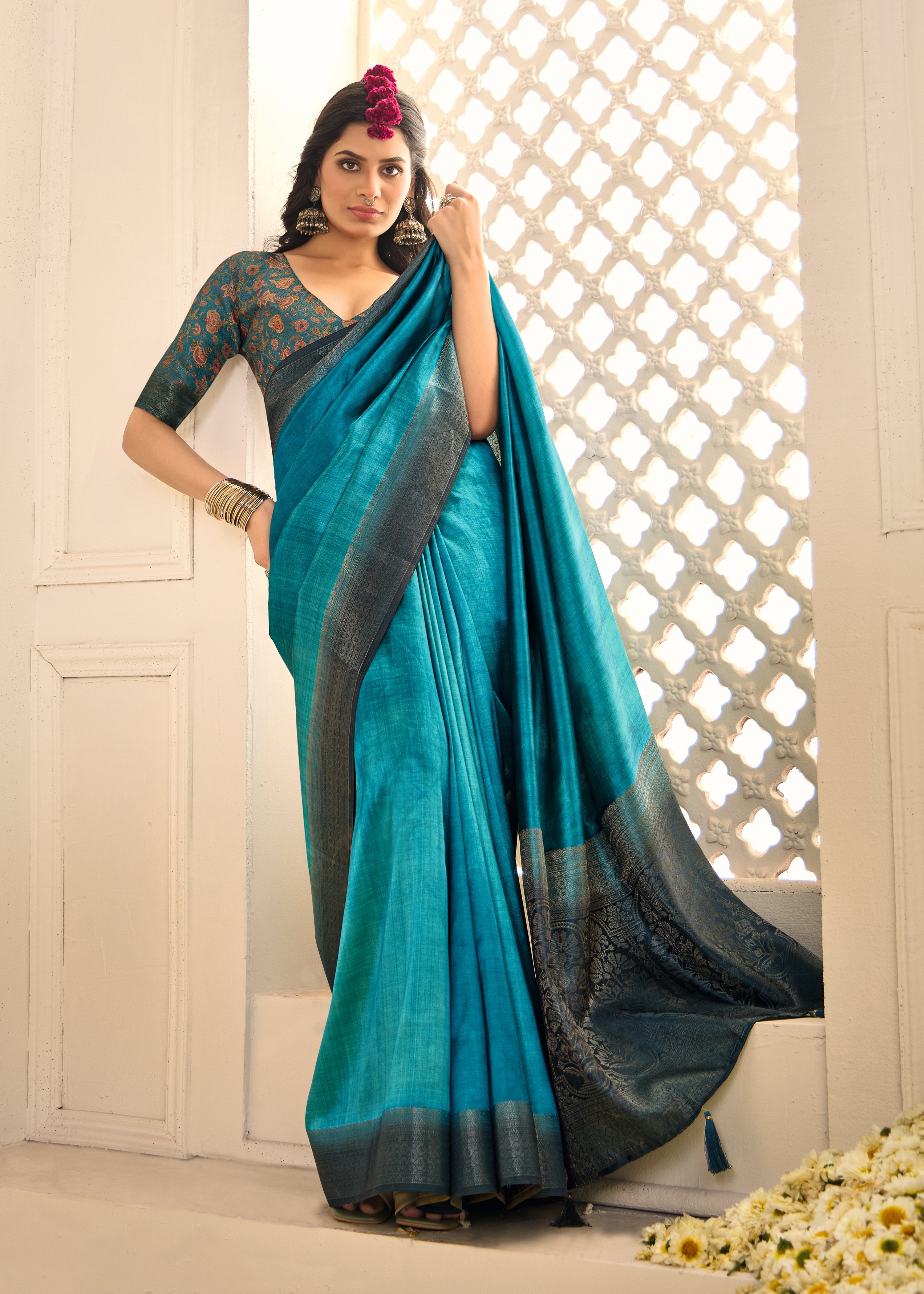 A sky blue and black tissue silk Banarasi style saree