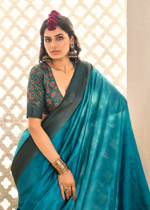 A sky blue and black tissue silk Banarasi style saree