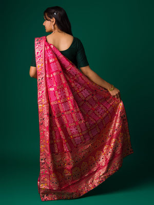 A pink and multicolor bandhani style saree
