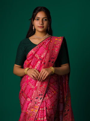 A pink and multicolor bandhani style saree