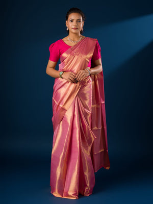 A pink and golden Banarasi silk saree with tissue pattern