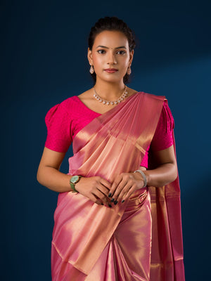 A pink and golden Banarasi silk saree with tissue pattern