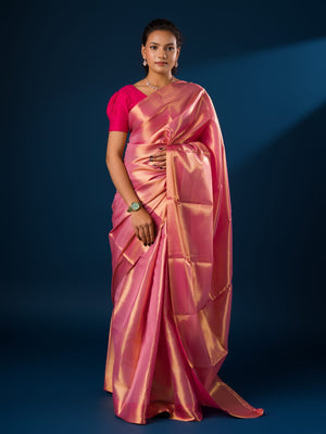 A pink and golden Banarasi silk saree with tissue pattern