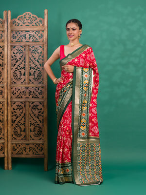A green and red pashmina cotton silk saree with a patola style pattern