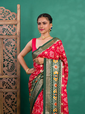 A green and red pashmina cotton silk saree with a patola style pattern