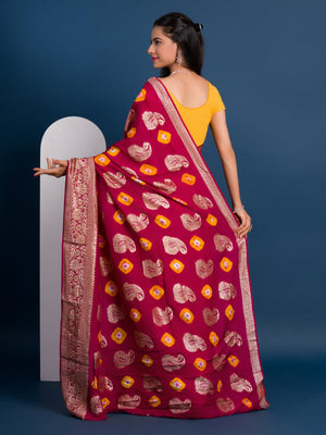 A maroon saree with gold patterns with Dola Silk Bandhani Zari Weaving Work