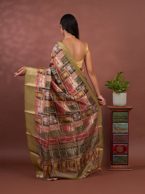 A saree with a kalamkari style pattern in green colors, with zari weaving and a Banarasi border. under 1000