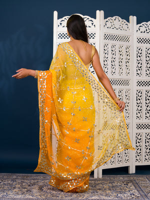 Yellow saree with white patterns Chiffon Bandhani Style With Gotapatti Work Saree