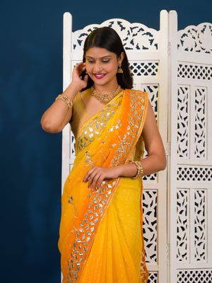 Yellow saree with white patterns Chiffon Bandhani Style With Gotapatti Work Saree