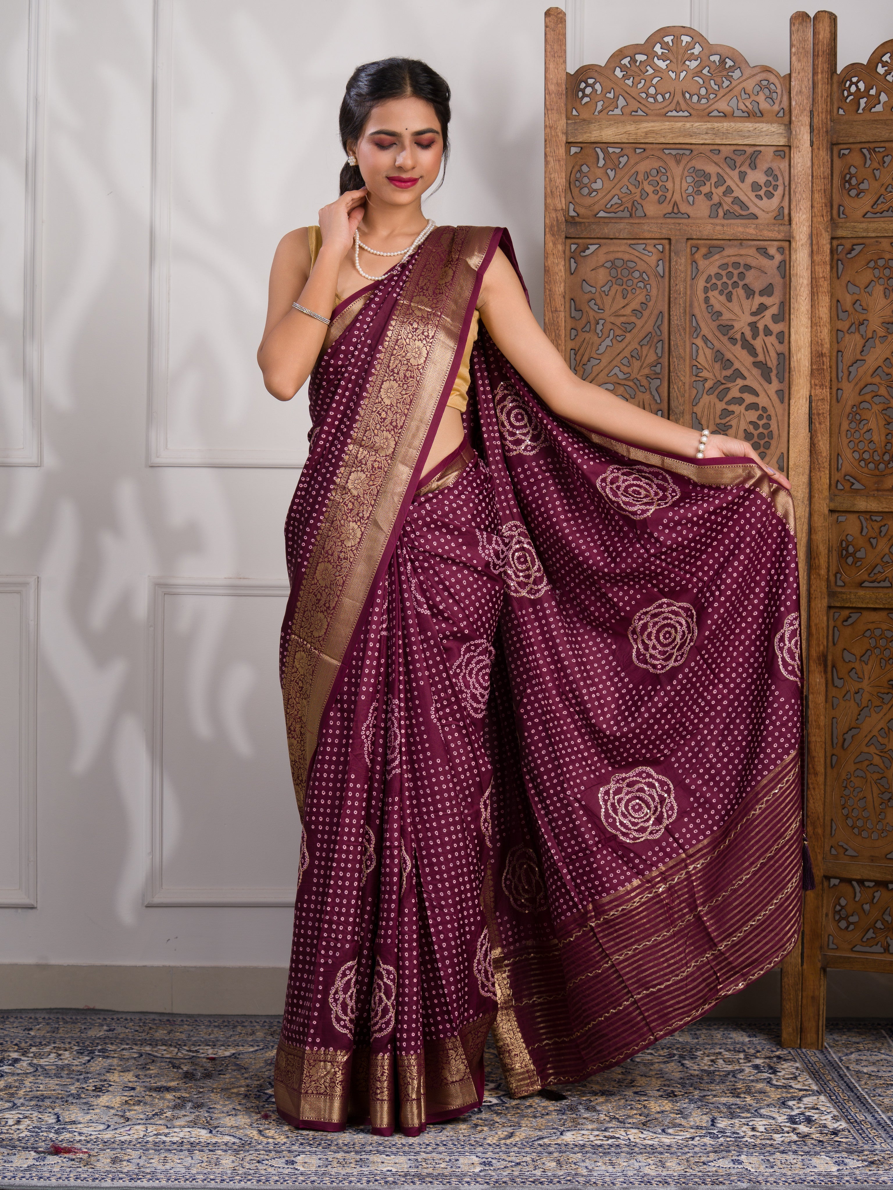 A wine and gold Upada silk saree with Bandhani style