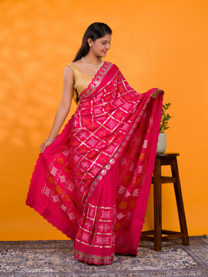 A pink saree with white patterns with Cotton silk Bandhani Gotapatti Work Saree