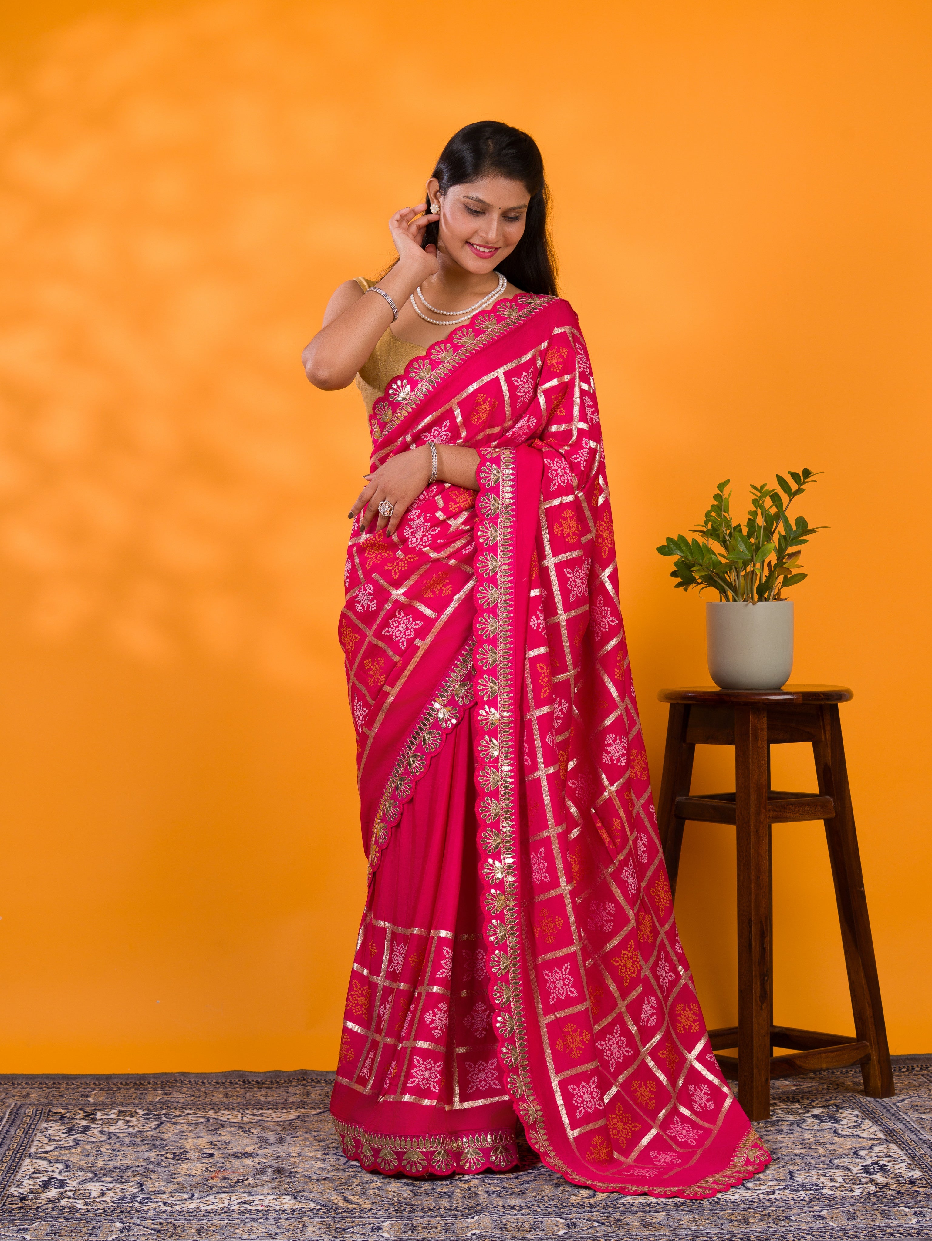 A pink saree with white patterns with Cotton silk Bandhani Gotapatti Work Saree