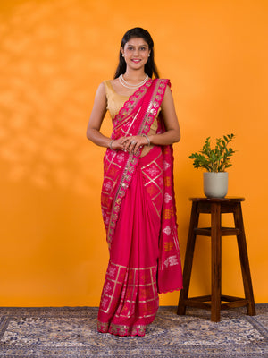 A pink saree with white patterns with Cotton silk Bandhani Gotapatti Work Saree