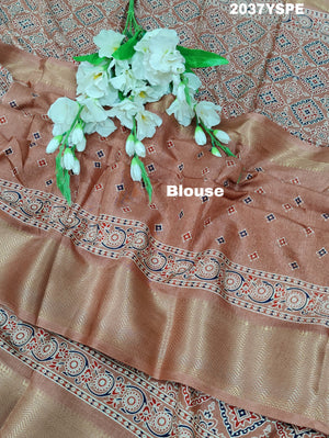 A peach and pink ajrakh style cotton silk saree