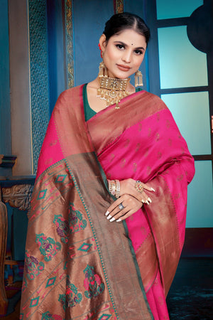 A pink and purple Banarasi Dola Silk saree with traditional Zari print work,