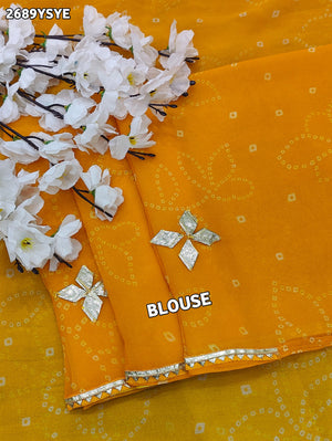 Yellow saree with white patterns Chiffon Bandhani Style With Gotapatti Work Saree