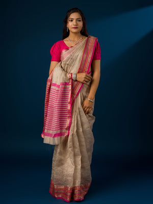 A cream-colored banarasi silk saree