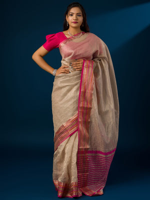A cream-colored banarasi silk saree