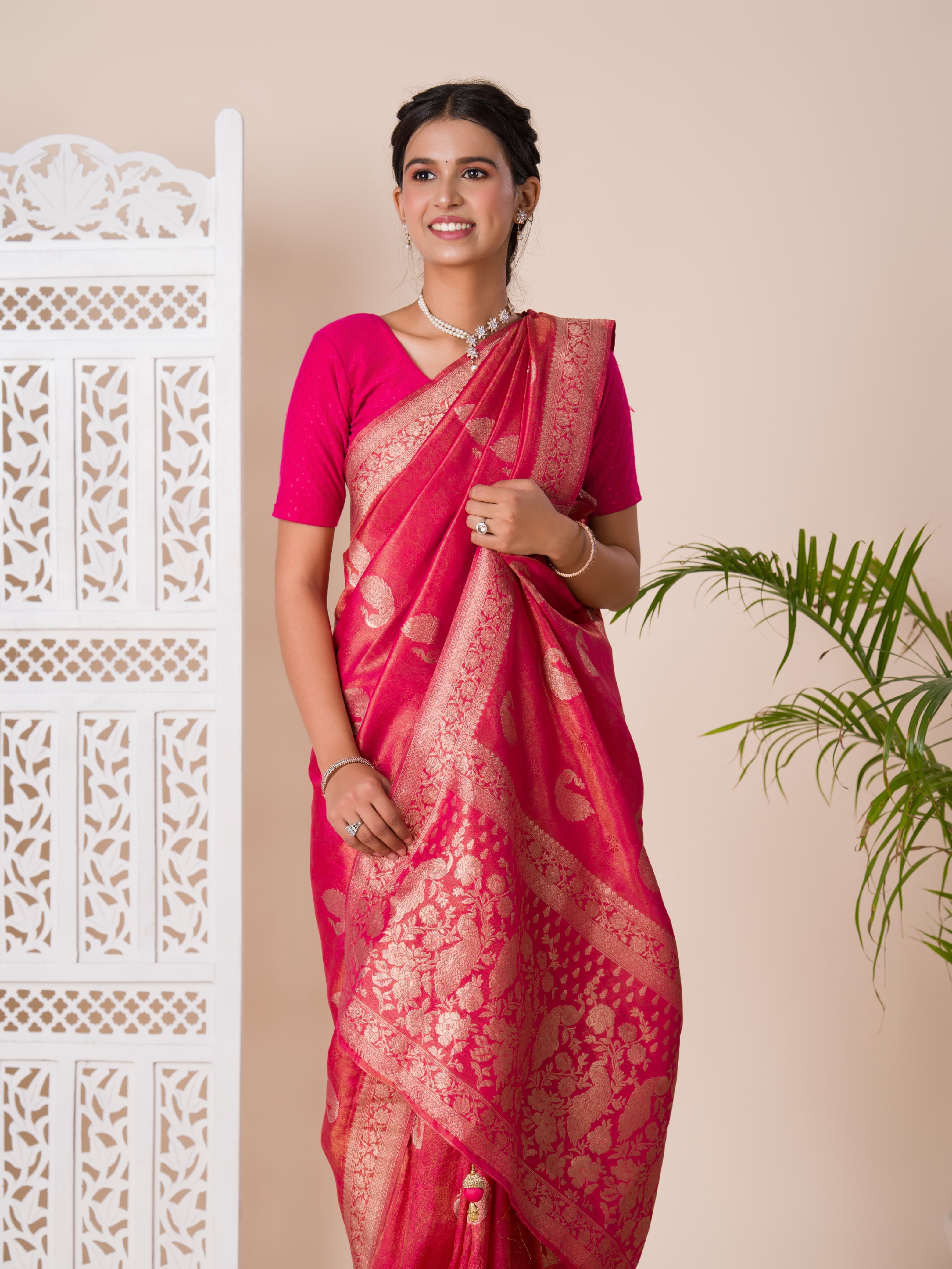 A red and golden Banarasi style saree with zari weaving,