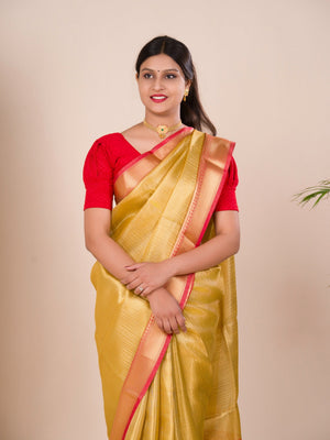 A Banarasi style saree in yellow and red with a tissue silk pattern, suitable for festival wear.