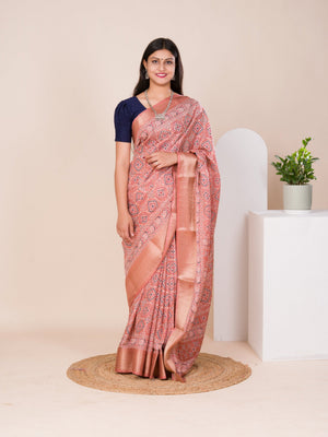 A peach and pink ajrakh style cotton silk saree