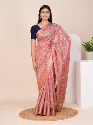 A peach and pink ajrakh style cotton silk saree