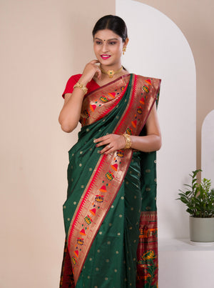 A green Paithani silk saree with a red zari border