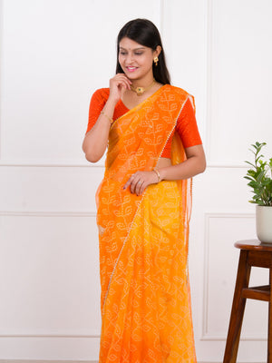 orange saree with a white print Chiffon Bandhani style With Vintage Work Saree