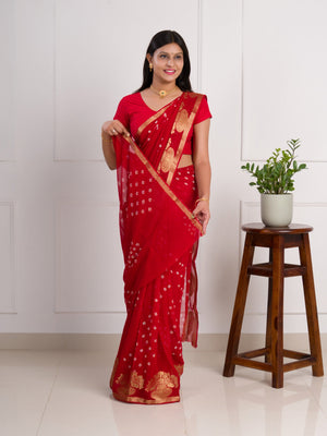 A red saree with gold patterns in Georgette Bandhani Style Saree