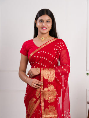 A red saree with gold patterns in Georgette Bandhani Style Saree