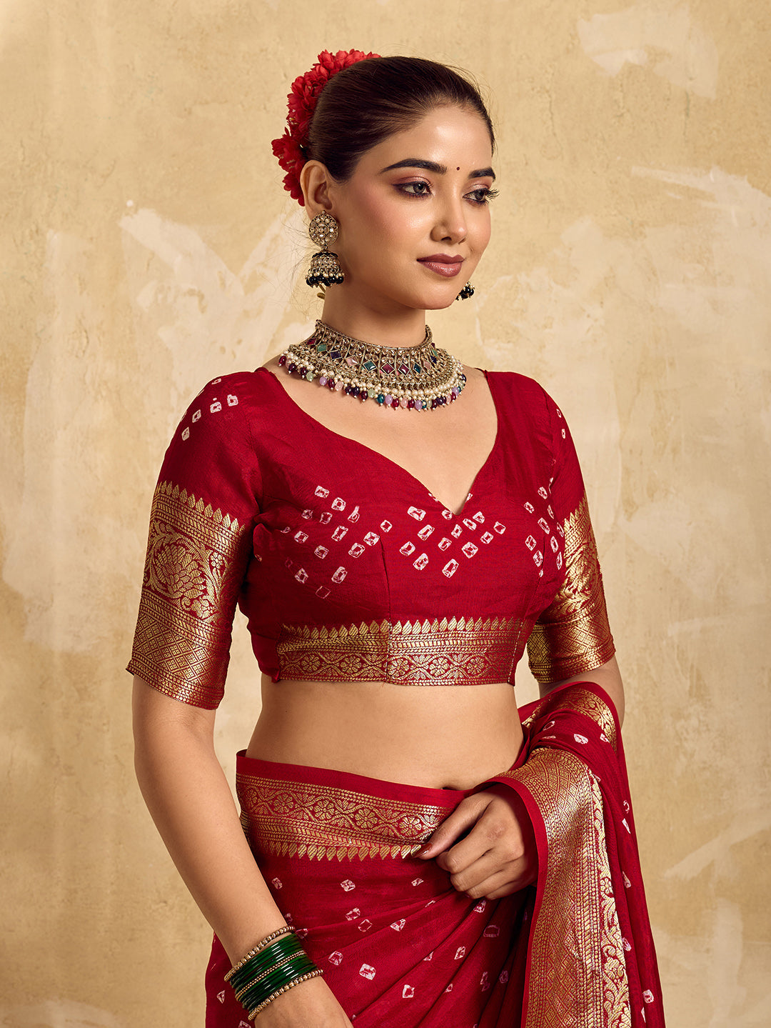  Buy red viscose silk saree with a bandhani pattern and zari border.