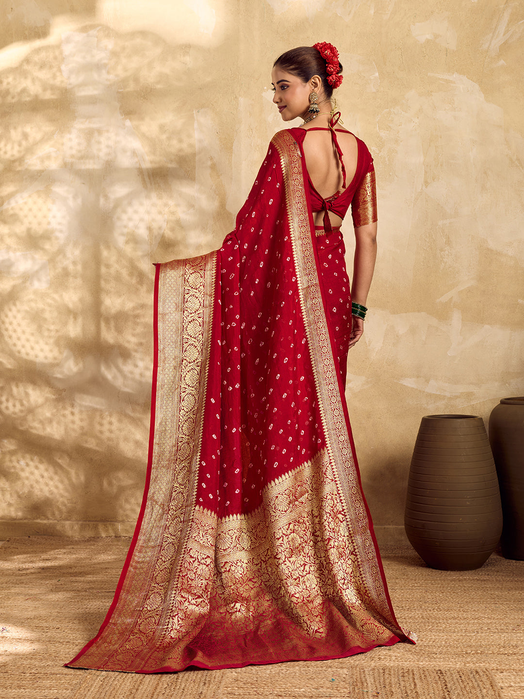  Buy red viscose silk saree with a bandhani pattern and zari border.