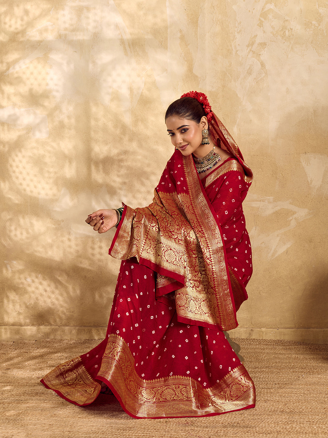  Buy red viscose silk saree with a bandhani pattern and zari border.