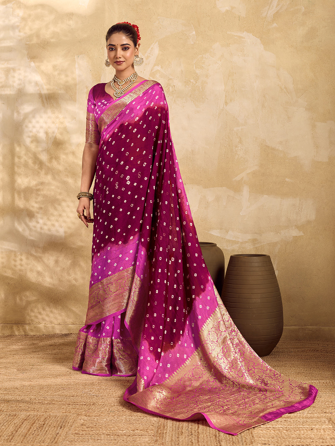  a red and pink Viscos silk bandhani saree with zari border and a pink blouse
