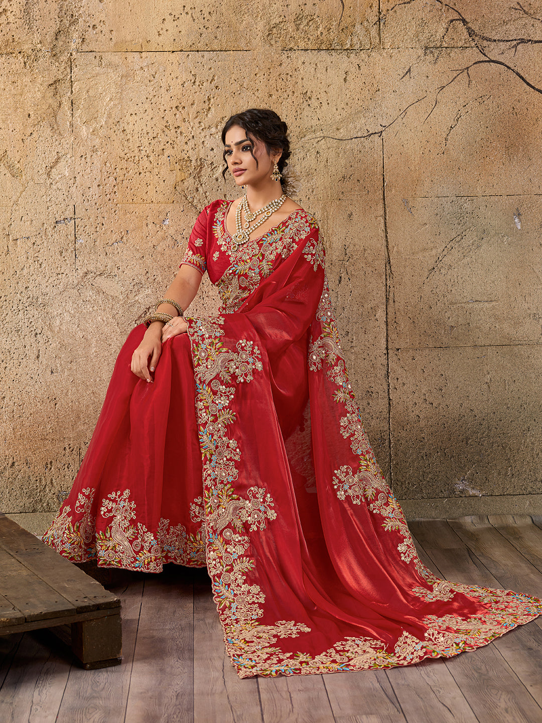 A red saree with floral embroidery 