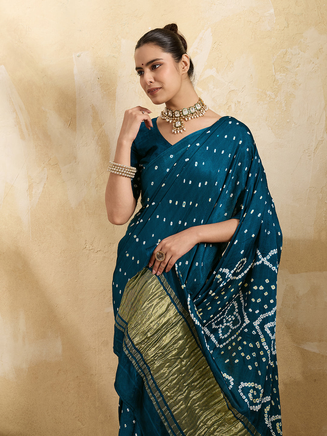 A blue saree with bandhani print and a lagdi patla pallu, 